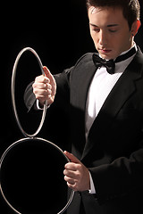 Image showing young magician with silver metal rings