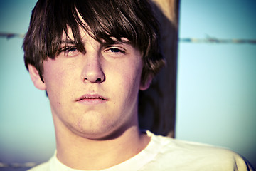 Image showing teen against fence