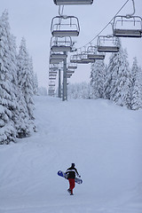 Image showing lone snow boarder on piste