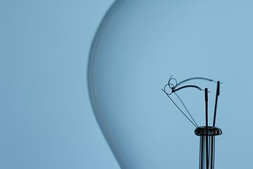 Image showing light bulb filament on blue background