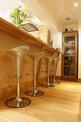 Image showing crome stools on wooded floor