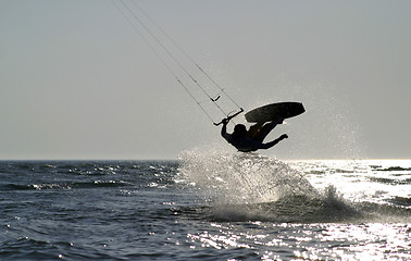 Image showing kite boarder jumping on the ocean