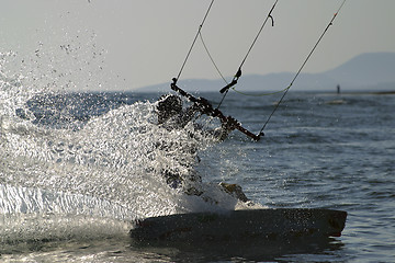 Image showing kite boarder carving his board