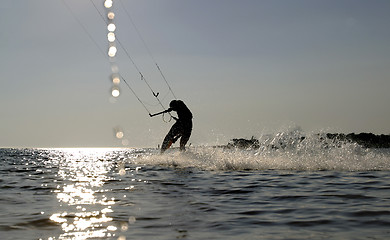 Image showing kite boarder surfing at speed