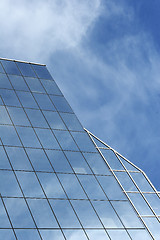 Image showing glass office building with reflection of blue sky