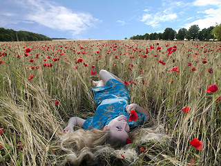 Image showing Blonde in poppies