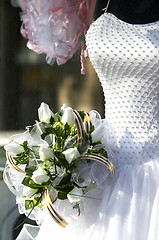 Image showing bridal gown and bouquet