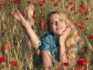 Image showing Barefoot blonde in poppies