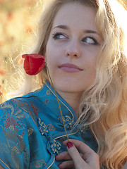 Image showing Blonde with poppy