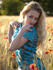 Image showing Blonde in poppy field