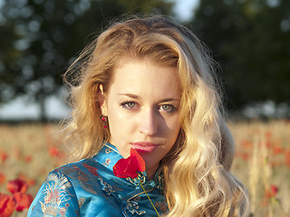 Image showing Blonde with poppy