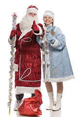 Image showing Santa Claus and snow maiden giving thumbs-up sign
