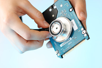 Image showing Doctor holding stethoscope at notebook hdd