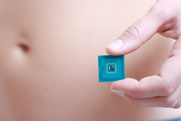 Image showing Woman holding Radio-frequency identification (RFID) tag card