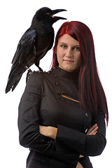 Image showing young witch with raven