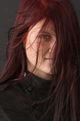 Image showing glance through red hair