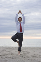 Image showing Businessman doing yoga