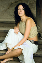 Image showing attractive woman sitting on wooden stairs