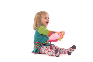 Image showing Happy baby sitting on the floor