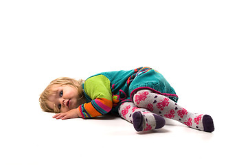 Image showing Baby lies on the floor