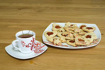 Image showing Cup of tea with cookies