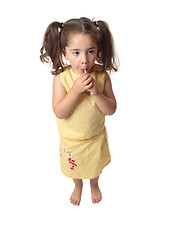 Image showing Girl sucking on a lollipop candy