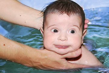 Image showing baby bathing, soft focus