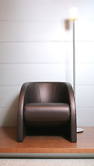 Image showing trendys leather easy-chair with floor-lamp