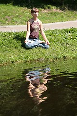 Image showing young woman is meditating