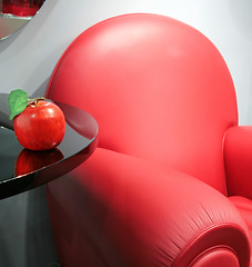 Image showing red leather chair and apple