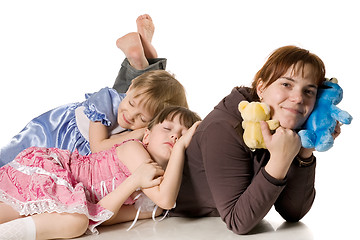 Image showing Two little girls sleeping on mum