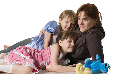 Image showing Mum and daughters lie on floor