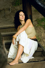 Image showing attractive woman on wooden stairs