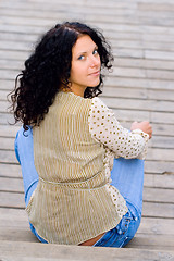 Image showing woman sitting on wooden floor