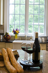 Image showing kitchen island with wine baguettes