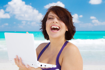 Image showing woman with laptop computer on the beach