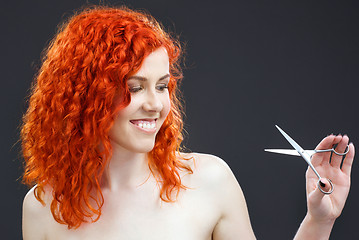 Image showing redhead with scissors