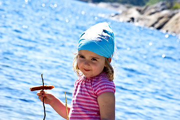Image showing Little girl at the sea