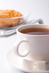 Image showing cup of tea, sugar and cookies