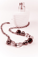 Image showing necklace and parfume bottle