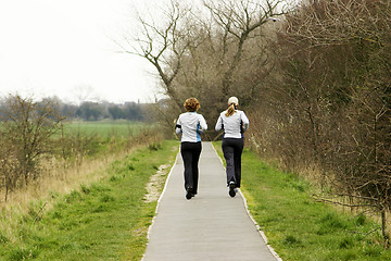 Image showing two female joggers on path