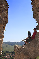 Image showing Working on a laptop
