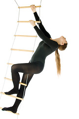 Image showing Woman on a rope ladder