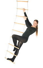 Image showing Woman on a rope ladder