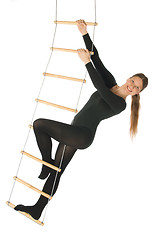 Image showing Woman on a rope ladder