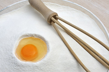 Image showing Flour and eggs ready for mixing