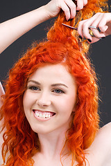 Image showing redhead with scissors