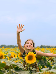 Image showing Beauty teen girl with sunflower
