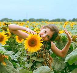 Image showing Beauty teen girl and sunflower
