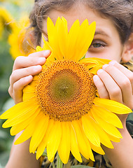 Image showing Beauty teen girl with sunflower
